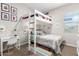 bedroom with a bunk bed, desk, and carpet flooring at 32582 N Durango Ln, San Tan Valley, AZ 85143