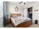 Bedroom with carpet flooring, wooden bed frame, and closet with a sliding door at 32582 N Durango Ln, San Tan Valley, AZ 85143