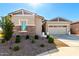 Charming single story home with stone accents and landscaped front yard, perfect for curb appeal at 32582 N Durango Ln, San Tan Valley, AZ 85143