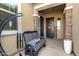 Inviting front porch with a bench and decorative elements, creating a welcoming entrance at 32582 N Durango Ln, San Tan Valley, AZ 85143