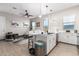 Open kitchen featuring pendant lights, a kitchen island, and hardwood flooring at 32582 N Durango Ln, San Tan Valley, AZ 85143