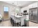 Bright open kitchen with quartz countertops, stainless steel appliances, and an island at 32582 N Durango Ln, San Tan Valley, AZ 85143