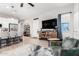 Open-concept living space with kitchen, modern furniture and fixtures, and sleek flooring at 32582 N Durango Ln, San Tan Valley, AZ 85143