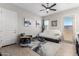 Cozy living room with wood-look flooring, a ceiling fan, and comfortable seating at 32582 N Durango Ln, San Tan Valley, AZ 85143
