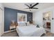 Relaxing bedroom featuring a modern headboard, soft lighting, and an attached bathroom, for a restful retreat at 343 S Cholla St, Gilbert, AZ 85233