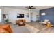 Comfortable living room showcases gray sofa, wood accents, decor, and a flat screen television at 343 S Cholla St, Gilbert, AZ 85233