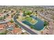 Aerial view of the community with a golf course, lush landscaping, and a serene lake at 4043 N Ranier --, Mesa, AZ 85215