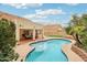 Private backyard featuring a sparkling pool, covered patio, and lush landscaping for serene outdoor living at 4043 N Ranier --, Mesa, AZ 85215