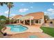 Beautiful backyard with a kidney shaped pool, a covered patio and manicured landscaping perfect for entertaining at 4043 N Ranier --, Mesa, AZ 85215