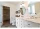 This bathroom features a dual sink vanity with updated fixtures and a walk-in closet at 4043 N Ranier --, Mesa, AZ 85215