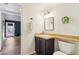 Cozy bathroom boasting a single sink vanity, tile countertops, and decorative towel hooks at 4043 N Ranier --, Mesa, AZ 85215