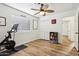 Bright bedroom featuring a sleek ceiling fan, vinyl floors, and a modern storage space at 4043 N Ranier --, Mesa, AZ 85215
