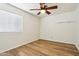 Well-lit bedroom featuring a ceiling fan, vinyl floors, and an abundance of natural light at 4043 N Ranier --, Mesa, AZ 85215