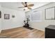 Comfortable bedroom featuring modern fan, vinyl floors, and an abundance of natural light at 4043 N Ranier --, Mesa, AZ 85215