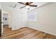 Bright bedroom featuring a ceiling fan, closet, vinyl floors and an abundance of natural light at 4043 N Ranier --, Mesa, AZ 85215