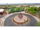 Beautiful community entrance with art installation, mature trees and landscaping at 4043 N Ranier --, Mesa, AZ 85215
