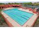 Aerial view of a large community pool surrounded by lounge chairs and recreational facilities, promoting active living at 4043 N Ranier --, Mesa, AZ 85215