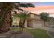 Charming two-story home featuring a well-manicured lawn and desert landscaping at 4043 N Ranier --, Mesa, AZ 85215