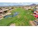 Scenic golf course view with lush green fairway and tranquil water feature at 4043 N Ranier --, Mesa, AZ 85215