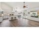 Open-concept kitchen with stainless steel appliances and adjacent dining area at 4043 N Ranier --, Mesa, AZ 85215
