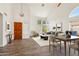 Bright and airy living room with vaulted ceilings and wood-look tile flooring at 4043 N Ranier --, Mesa, AZ 85215