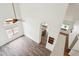 Bright living room boasting wood-look tile floors, arched doorway, and contemporary ceiling fan at 4043 N Ranier --, Mesa, AZ 85215