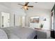 The main bedroom offers modern decor, neutral paint, and access to an ensuite bathroom at 4043 N Ranier --, Mesa, AZ 85215