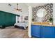The main bedroom boasts floral wallpaper accents, a built-in counter, and an ensuite bathroom at 4043 N Ranier --, Mesa, AZ 85215