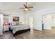 The main bedroom features neutral decor, a ceiling fan, and ensuite bathroom access at 4043 N Ranier --, Mesa, AZ 85215
