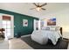 Main bedroom features an accent wall, modern decor, and access to the backyard at 4043 N Ranier --, Mesa, AZ 85215