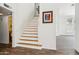 This staircase features a bright open floor plan and stylish flooring at 4043 N Ranier --, Mesa, AZ 85215