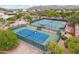 Overhead view of the community tennis courts featuring well-maintained playing surfaces at 4043 N Ranier --, Mesa, AZ 85215