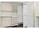 This walk-in closet offers ample storage space and built-in shelving at 4043 N Ranier --, Mesa, AZ 85215