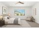 Bedroom with large window, ceiling fan, neutral color palette, and comfortable furnishings at 4051 S Galaxy Ln, Mesa, AZ 85212