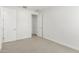 Neutral bedroom with carpeted floors, white doors, and ample space at 4051 S Galaxy Ln, Mesa, AZ 85212
