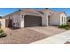 Attractive single-story home featuring brown tile roof, two car garage and low maintenance landscaping at 4051 S Galaxy Ln, Mesa, AZ 85212