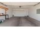 Spacious two-car garage with overhead storage and ample space at 4051 S Galaxy Ln, Mesa, AZ 85212