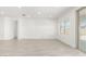 Bright living room with neutral tile flooring, large windows and open floor plan at 4051 S Galaxy Ln, Mesa, AZ 85212