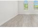 Open living room showcasing tile floors and natural light from arched windows at 4051 S Galaxy Ln, Mesa, AZ 85212