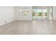 Bright living room with neutral tile flooring, large windows and sliding glass doors at 4051 S Galaxy Ln, Mesa, AZ 85212