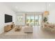 Open living space with dining area, light wood floors, and sliding glass doors to backyard at 4051 S Galaxy Ln, Mesa, AZ 85212