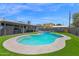 Expansive backyard with a sparkling pool, spa, and ample space for outdoor activities at 4137 E Sells Dr, Phoenix, AZ 85018
