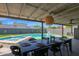 Backyard dining table next to pool and spa, perfect for entertaining guests at 4137 E Sells Dr, Phoenix, AZ 85018