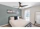 Bright bedroom with a comfortable bed, stylish decor, and direct access to the backyard at 4137 E Sells Dr, Phoenix, AZ 85018