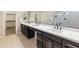 Large bathroom with double vanity, lots of counter space and cabinets, and modern sinks at 4141 E Morrison Ranch Pkwy, Gilbert, AZ 85296
