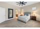Lovely bedroom with neutral walls, bedside tables, and bathroom and closet that add functionality at 4141 E Morrison Ranch Pkwy, Gilbert, AZ 85296