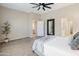 Spacious bedroom boasting neutral paint, ceiling fan, and doorways that add to the open feel at 4141 E Morrison Ranch Pkwy, Gilbert, AZ 85296