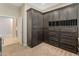 Custom closet featuring built-in shelves, drawers, and gray cabinetry with ample storage space at 4141 E Morrison Ranch Pkwy, Gilbert, AZ 85296