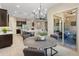 Cozy breakfast nook with modern chandelier and comfortable seating is situated off the kitchen and living area at 4141 E Morrison Ranch Pkwy, Gilbert, AZ 85296