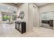 Open-concept living area with tile flooring, decorative furniture, and access to an adjacent office at 4141 E Morrison Ranch Pkwy, Gilbert, AZ 85296